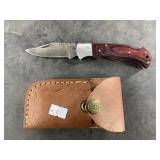 Damascus bladed lock back folding knife with leath