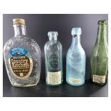 Four glass bottles: antique SW Bend Washington Sod