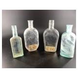 Collection of rare antique bitters bottles and fla