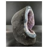 Brazilian amethyst geode boulder with a polished o