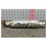 Glass rolling pin full of sea shells