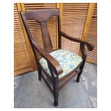 Wood arm chair.   Look at the photos for more