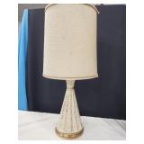 MCM lamp has cloth shade.  Look at the photos