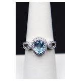 Sterling oval cut blue topaz ring, lab grown