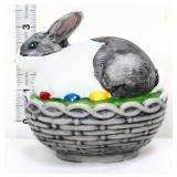 Grey/white painted bunny on nest