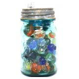 Blue fruit jar w/ glass marbles inside