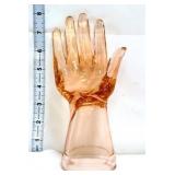 Pink glass jewelry hand