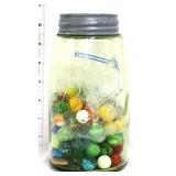 Vintage green glass fruit jar w/ marbles inside