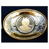 Metal belt buckle w/ Trump coin in center