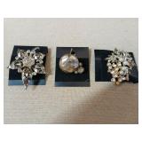 Three Brooches