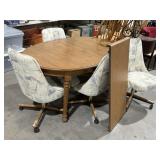 MCM STYLE DINING ROOM TABLE W/ 4 ROLLING CHAIRS