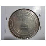 $1 CASINO TOKEN - 1990 SILVER DOLLAR