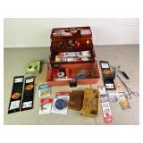 Tackle box with assortment of fishing supplies