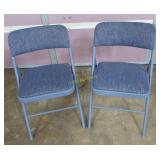 2 blue folding chairs