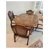 Dining Table & 4 Cane Back Rolling Chairs