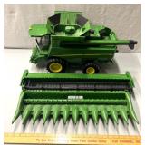 Large plastic, John Deere S670 combine with corn