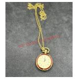 Gold toned watch necklace master