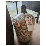 Glass carboy full of corks