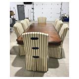 Table and 8 rolling chairs 107ï¿½ x 46ï¿½