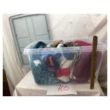 Clear, hefty tote filled with throws