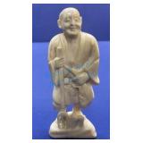 Carved ivory fisherman 3 1/2 inches tall