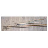 Vintage bamboo fishing rods and metal spear