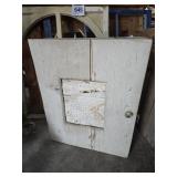 Old wall-mount cabinet. Decorative metal center on