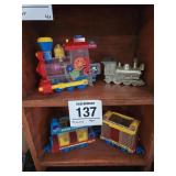 Vintage plastic trains (3) &metal piggy bank train