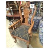 Upholstered, carved arm chair 42" t x 23" w