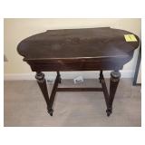 ANTIQUE TABLE WITH INLAID TOP AND BRASS TRIM -