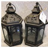 Matching pair of black candle holders, glass