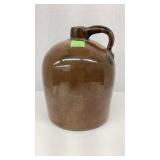Vintage stoneware whiskey jug with cork.