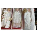 3 boxed dolls, new like condition,