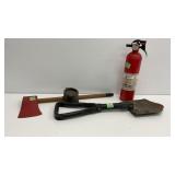 Red axe, entrenching tool, fire extinguisher