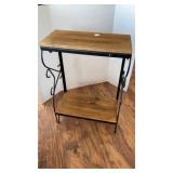 2 shelf wood table with metal frame, marks on top