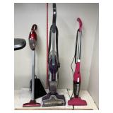 3 vacuum cleaners, 2 are bissel