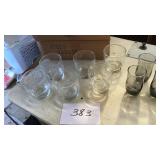 Six Drinking glasses with an M on them ,