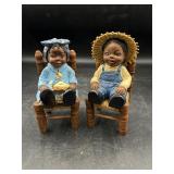 Black Americana two figures on chairs