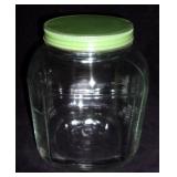 Vintage glass jar w/ green lid.