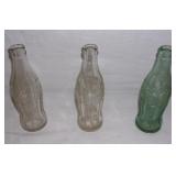 Vintage 6 oz. Coca-Cola bottles.